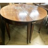 A pair of George III mahogany D shaped table sections, each measures length 120cm, depth 56cm,