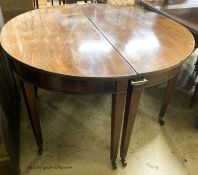 A pair of George III mahogany D shaped table sections, each measures length 120cm, depth 56cm,