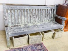 A weathered teak garden bench, length 182cm, depth 68cm, height 94cm