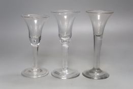 Three 18th century plain stem ale glasses, tallest 16.5cm