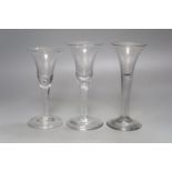 Three 18th century plain stem ale glasses, tallest 16.5cm