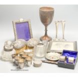 Sundry small silver including a trophy goblet, 22.5cm, napkin rings, two photograph frames, match