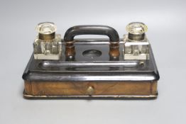 A Victorian walnut and ebonised desk stand with single drawer, 30cm wide together with a framed