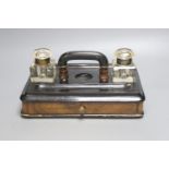 A Victorian walnut and ebonised desk stand with single drawer, 30cm wide together with a framed