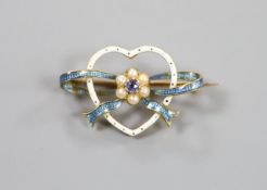 An Edwardian yellow metal, enamel, gem and seed pearl cluster set heart shaped brooch, 27mm, gross
