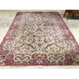 A Persian style ivory ground carpet, 380 x 280cm