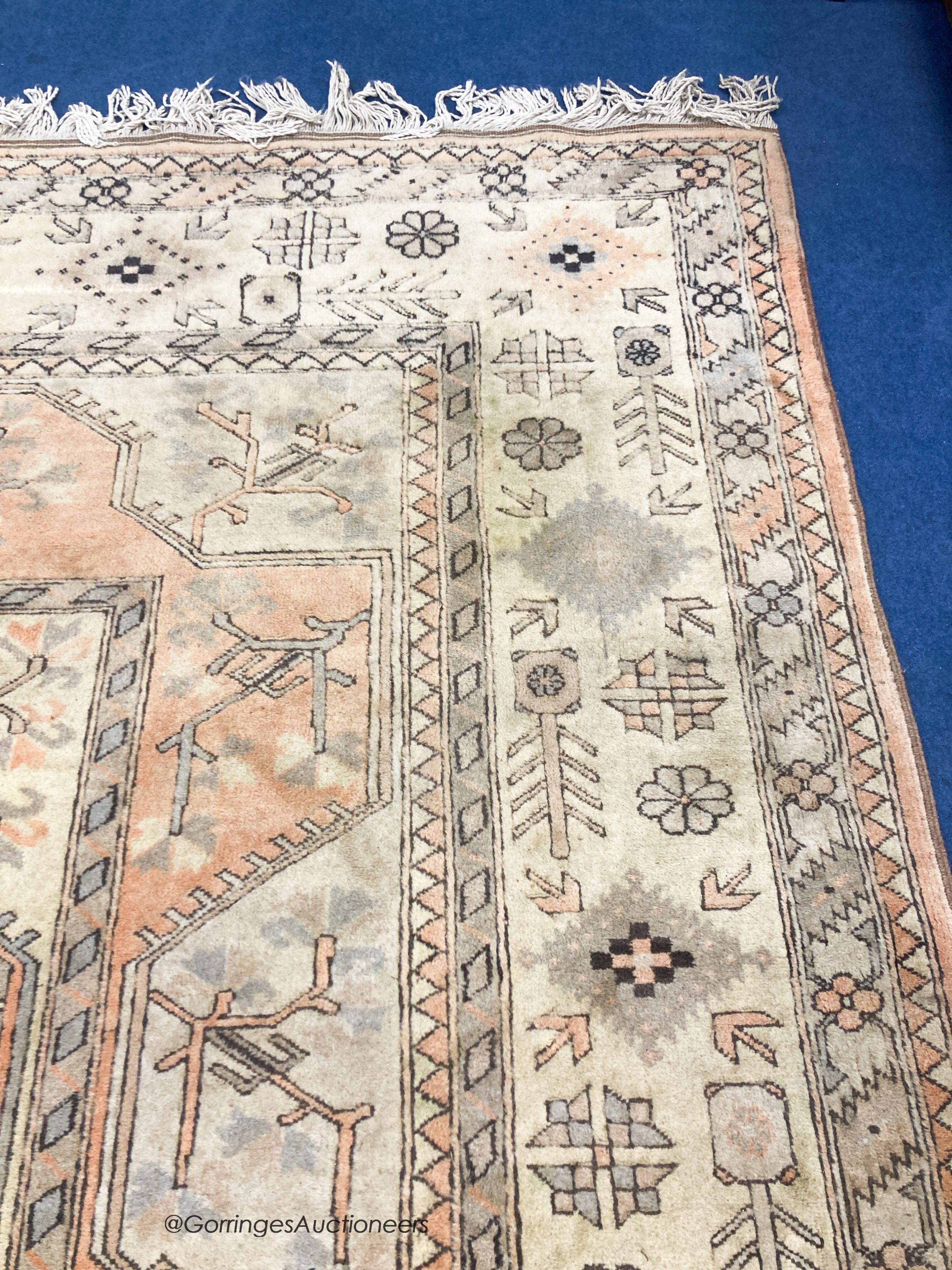 A large Caucasian Turkish design fawn ground carpet, 420 x 300cm - Image 5 of 7