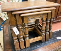 A nest of three reproduction rectangular oak tea tables, largest W.60cm W.32cm H.45cm