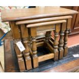 A nest of three reproduction rectangular oak tea tables, largest W.60cm W.32cm H.45cm