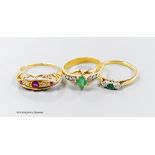 Three assorted modern 18ct gold and gem set rings, including emerald and diamond, ruby and diamond,