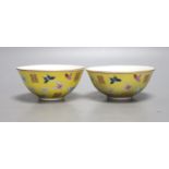 A pair of Chinese yellow ground porcelain small bowls, enamelled with butterflies, diameter 11cm