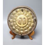A Tibetan gilt bronze stand, inscribed in sanskrit, 26cm