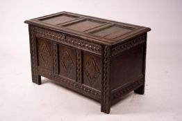 A 17th century carved panelled oak coffer, length 115cm, depth 56cm, height 67cm