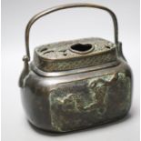 A Chinese bronze hand warmer, Xuande mark to base, old repairs15cm