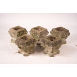 A set of five reconstituted stone lion mask square garden planters, W.30cm H.32cm