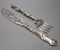 A pair of Victorian pierced silver fish servers, with loaded handles, Hilliard & Thomasson,