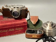 A cased Leica Ernst Leitz Wetzlar nr. 606583 camera together with light meter, lenses etc.