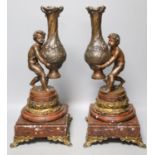 A pair of 19th century patinated spelter and marble figural lamp bases39cm