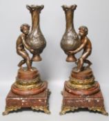 A pair of 19th century patinated spelter and marble figural lamp bases39cm