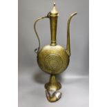 A Persian engraved brass ewer and Middle-eastern horn and white metal priming shot flask57cm