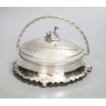 A silver plated powder box, the lid with swan finial.