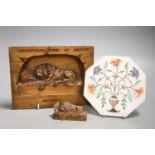 A walnut Lion of Lucerne plaque and carving and an Indian hardstone plaque