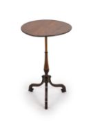 A George III mahogany wine table,with plain circular top, on slender spiral fluted baluster stem and