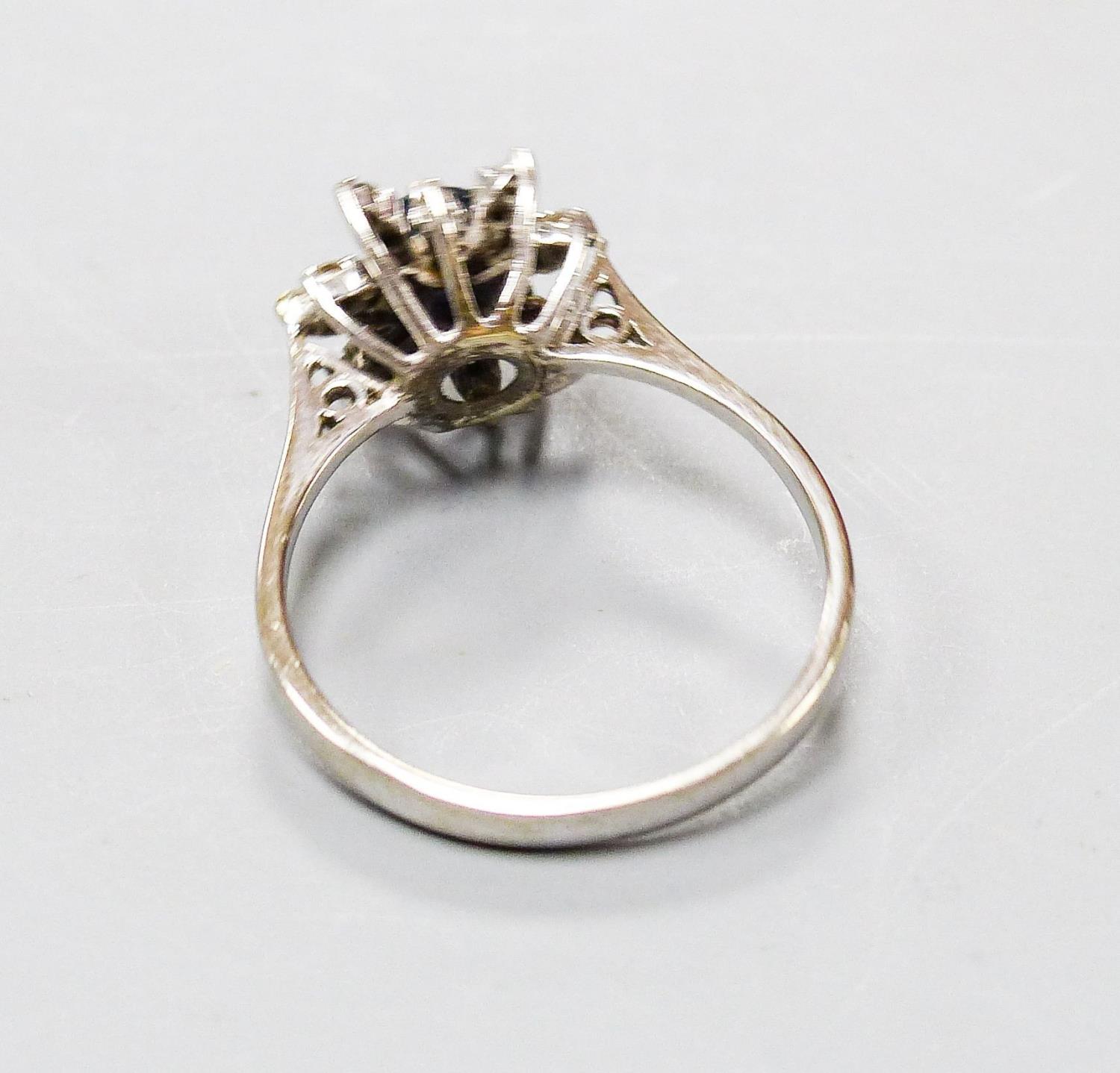 An 18ct white metal, sapphire and diamond set flower head cluster ring, size O, gross 3 grams. - Image 3 of 3