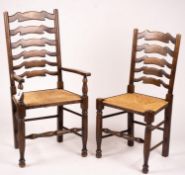 A set of ten 18th century style beech ladderback rush seat dining chairs, two with arms