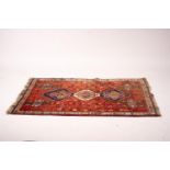 A Shiraz red ground rug geometric rug, 160 x 120cm