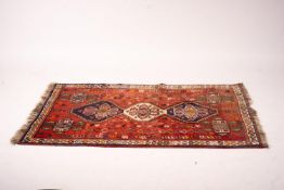 A Shiraz red ground rug geometric rug, 160 x 120cm