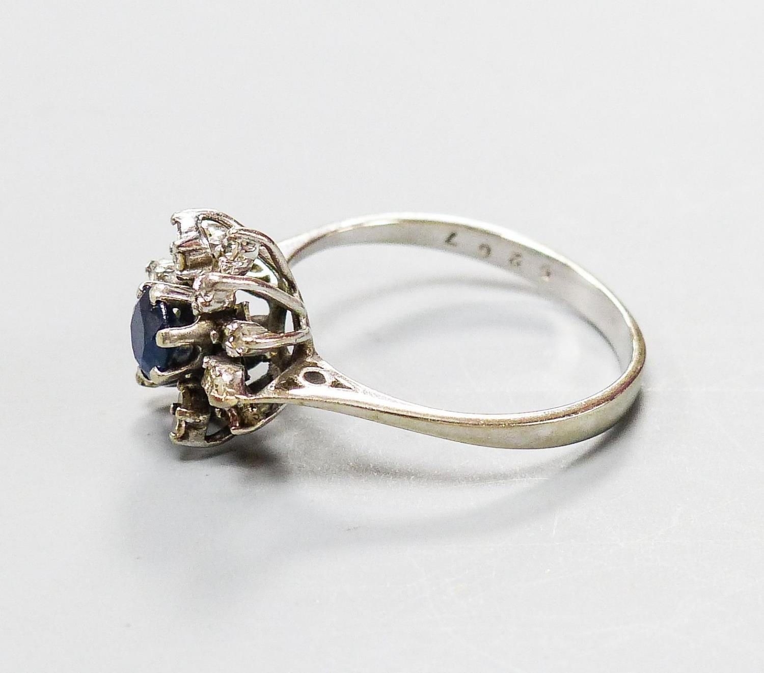 An 18ct white metal, sapphire and diamond set flower head cluster ring, size O, gross 3 grams. - Image 2 of 3