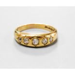 A late Victorian 18ct gold and graduated five stone gypsy set five stone ring, size Q, gross