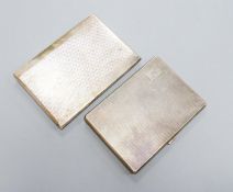 Two George V engine turned silver cigarette cases, largest 12.4cm, gross 12.5oz.