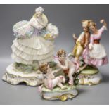 A Luigi Fabris porcelain figure of a lady wearing a crinoline dress, holding baskets of flowers, and