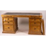 A reproduction pine kneehole desk, width 174cm, depth 79cm, height 86cm together with a matching