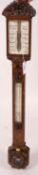 A Victorian carved walnut stick barometer by Chadburn Bros., Sheffield, height 104cm