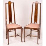 An Edwardian Art Nouveau inlaid mahogany towel rail and a pair of matching salon chairs (3)