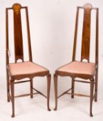 An Edwardian Art Nouveau inlaid mahogany towel rail and a pair of matching salon chairs (3)