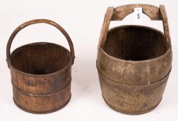 A Chinese staved wood rice carrier together with a circular iron bound staved wood bucket, larger