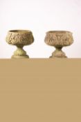 A pair of reconstituted stone circular garden planters on pedestal bases, diameter 45cm, height