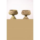 A pair of reconstituted stone circular garden planters on pedestal bases, diameter 45cm, height