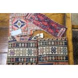 A Shah Savan Soumac salt bag, 45 x 31cm. a near pair of Soumac cushions, 34 x 34cm. and a