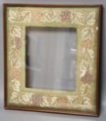 A mahogany picture frame with needlework mount48x42cm