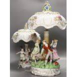 Two pairs of German porcelain table lamps, the stems modelled with figures dancing56cm