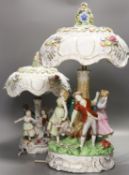 Two pairs of German porcelain table lamps, the stems modelled with figures dancing56cm