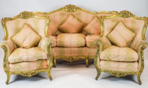 A Louis XV style carved gilt wood five piece suite, consisting of a three seater settee and four