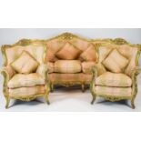 A Louis XV style carved gilt wood five piece suite, consisting of a three seater settee and four