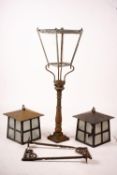 A Victorian style lantern on cast iron base, height 143cm together with a pair of lanterns and a