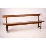 A Victorian pitch pine bench seat, W.214cm H.79cm